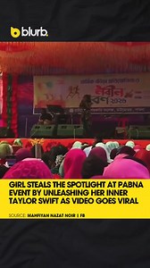 A clip from a recent college program in Pabna has gone viral after a student delivered a confident rendition of Taylor Swift’s hit “Cruel Summer,” earning loud cheers from the crowd. The video captures her performing on stage as fellow students record and share the moment online. Within hours, the footage spread widely across social media, with viewers applauding her voice and stage presence, calling it a true Swiftie moment. | The Daily Blurb
