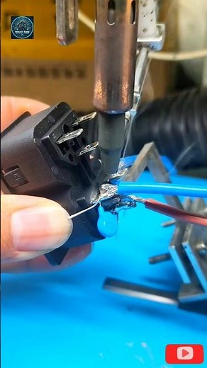 The video displays the process of soldering electrical wires to an electrical connector. A soldering