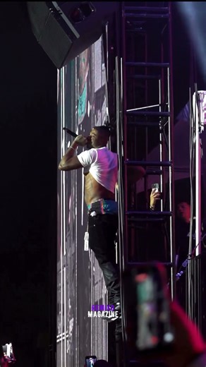 Blueface climbs on top of stage fixtures at concert