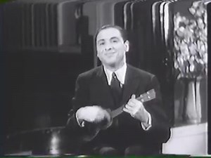 Some even earlier vintage two-hand tapping footage than that of Vittorio Camardese in 1965. This time we are looking at Roy Smeck in the 1930s performing “Rubenstein's Melody in F,“ on a ukulele, using all sorts of techniques that modern guitar players use today, including finger tapping, percussive effects and by the looks of it, Pete Townshend's Windmill. | The GuitArchive