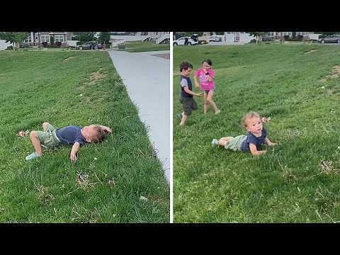 Toddler can't figure out how to roll down hill