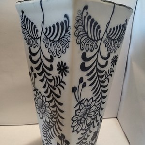Tall vase with beautiful  deco with details of flowers and details made china