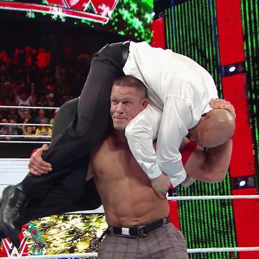 On this day in 2014, John Cena muscled up J&J Security for a DOUBLE Attitude Adjustment in a battle with Seth Rollins! | WWE