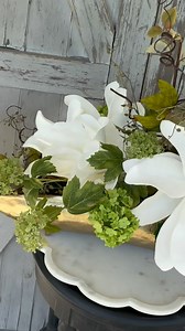 Here’s a little floral magic in fast-forward💐🤍✨Hope this beauty brings you some inspo for your next centerpiece moment! This exact design is available now in our shop🤍 We are now also taking custom orders—send us a message if you’re interested and let’s bring your idea to life😍 #thetrendywreathhouse #florals #floralarranging #floralsforspring #floralarrangements #spring #springarrangement #springtime #springdecor #springishere #springmantel #homedecor #homedecorideas #reels #reelsoftheday #r