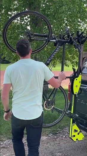 Load your bike. Tilt the rack. Open the tailgate.