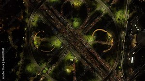 night time illumination jakarta city center high traffic street road interchange aerial topdown panorama 4k indonesia