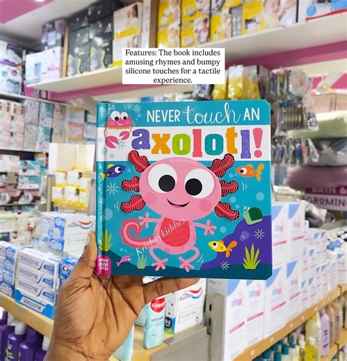 KRISKAY KIDDIES MUM &BABY SHOP on Instagram: "🎄AVAILABLE NOW🎅This is the children’s board book Never Touch an Axolotl! by Cara Jenkins and illustrated by Stuart Lynch, published by Make Believe Ideas. It is part of the bestselling “Never Touch” series. The book features amusing rhymes and bumpy silicone textures for a tactile experience. It is designed to help young children develop fine motor skills, language skills, and critical thinking. The book has bright colors, charming illustrations, a