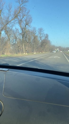 Military Trucks in Motion: A Roadside Perspective