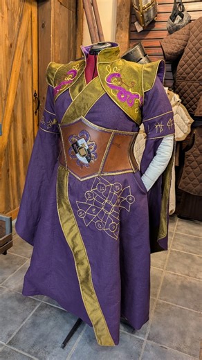 🐍💜 Serpentine Priestess 💜🐍 Another project done for a vampire LARP! This time, a serpentine priestess 🐍 I LOVE the colors on this and the simplicity of it. The cut of the dress and the small amount of embroideries makes this really chic and unique. #larp #fantasy #larpersofinstagram #fantasycouture #feralworkshop #larper #embroidery #fantasydress | Feral-Workshop/ Atelier Feral