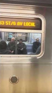 Manhattan bound R160A-2 F leaving Roosevelt Av