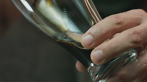 Pouring a stout beer into a glass - Free Stock Video