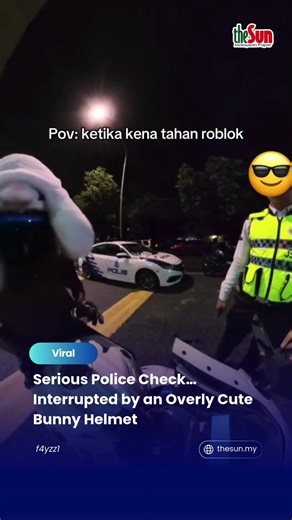 08 Jan 2026: When the IC and driving licence check is all professional… but the bunny helmet is just too irresistible 🐰🤏 Touched once. Touched twice. Okay… FOUR times already 😆 Even the law can’t resist cuteness. #theSun #theSunMY #TooCuteToIgnore #BunnyHelmet #PolisPunManja