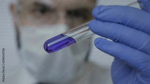 Focused life science professional working on experiment in high protection degree work laboratory. Healthcare and biotechnology. Senior male researcher carrying out scientific research in a lab.