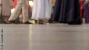 People dancing together at a dancing class party, learning to dance folk and ballroom dances.