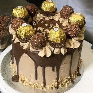 289K views · 3K reactions | Ferrero Rocher Deluxe Cake Nationwide Delivery www.dessertsdeliveredbakery.co.uk | Desserts Delivered Bakery | Facebook