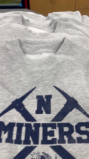 It’s beginning to look a lot like Christmas! New Miner merch has arrived and will be available at all home basketball games! Adult and youth crew necks, long sleeve Ts, and short sleeve Ts available! Also, hats, golf balls and ball markers, flags, and stadium seats! | Negaunee High School Booster Club