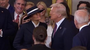 Donald Trump and Melania Trump share awkward kiss at inauguration