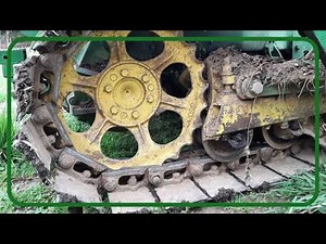 John Deere 420 Crawler/ Digging a ditch with a 2-way blade