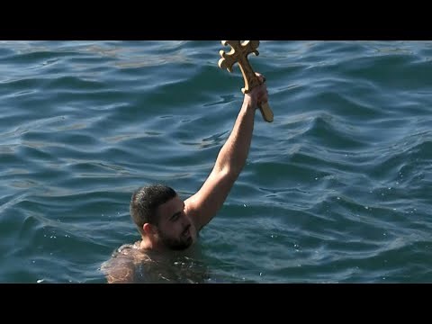 Swimmers in Greece and Turkey celebrate Epiphany with icy plunge | AFP
