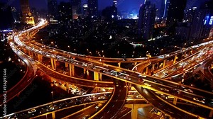 Aerial View of freeway busy city rush hour heavy traffic jam highway,shanghai Yan'an East Road Overpass interchange,Brightly lit modern urban building.
