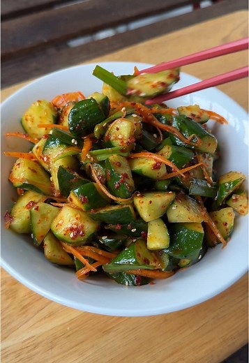 QUICK CUCUMBER KIMCHI 🥒🌶️🥢 A spicy, crunchy side dish you can whip up in under 10 minutes! - 1 large cucumber (or 3 - 4 small cucumbers) - 1 tsp salt - 15g garlic chives, cut into 2, pieces - ½ medium carrot, julienned (optional) Marinade - 2 tbsp rice vinegar - 2 tbsp gochugaru (Korean red pepper flakes) - 1 tbsp caster sugar - 1 tbsp fish sauce - 1 garlic clove, finely minced - ½ tbsp toasted sesame oil - ½ tbsp toasted sesame seeds To make the marinade, mix together the rice vinegar, gochu