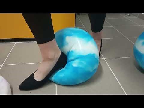 Girl Crushing inflatable Balls with High Heels an Chucks