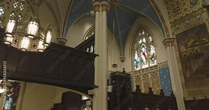 Inside The Medieval Cathedral With Stained Glass Windows. Aerial Drone Shot