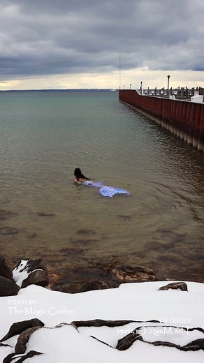 A mermaid swims in the winter (in Lake Michigan) 🌨 This video shows a mermaid swimming in Lake Michigan while snow rests on the ground around the water. This video was filmed last year, since EVEN THOUGH WE HAVE SNOW I can't swim because of my recent biopsy incision. It would have been the perfect day for a winter swim too. 🥲🖤 Today, we've had whiteout conditions (periodically) and have already gotten many inches of snow. It's not even the middle of November yet, but this is Northern Michigan