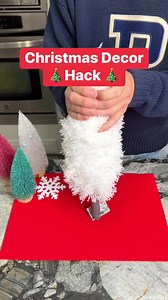 Using a feather duster to creat a Christmas tree with lights. | The Gooch