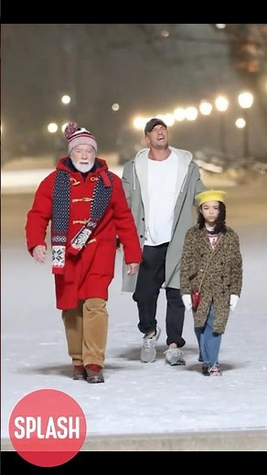 Arnold Schwarzenegger And Alan Ritchson Try To Keep Warm Filming "The Man With The Bag" In New York