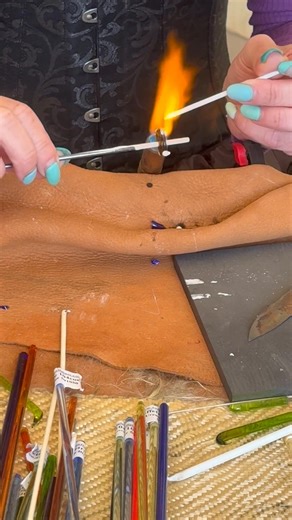 Mesmerising…watching a Viking glass bead being made. | MedievalHistoria