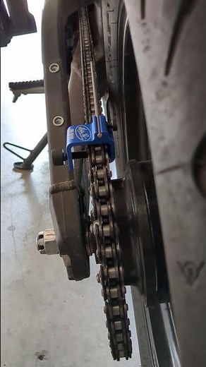 Motorcycle chain alignment guide.