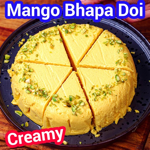 Bhapa Doi: bit.ly/2y5CkVA Mango Kulfi: bit.ly/2YBfzBN Learn to make Mango Bhapa Doi – a no-bake, steamed yoghurt cheesecake rich, creamy, and bursting with mango flavour! A traditional Bengali dessert with a tropical twist, this easy recipe needs no oven or gelatin and is made with just a few ingredients. This mango delight is light, satisfying, and irresistible for summer or festive occasions! #hebbarskitchen | Hebbar's Kitchen