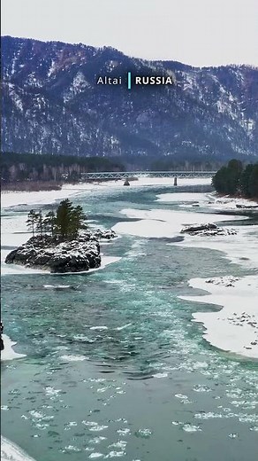 Aerial cinematic view of snow covered beautiful Altai