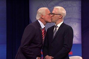 Woody Harrelson plays Joe Biden giving Anderson Cooper a kiss on ‘SNL’