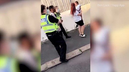Moment woman gets smashed over the head with a bottle in street fight in Leeds