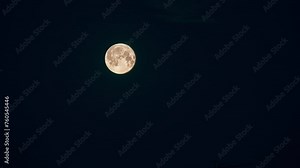 Moon in Dark Night Sky natural Background. video night nighttime timelapse. white and Yellow Moon.