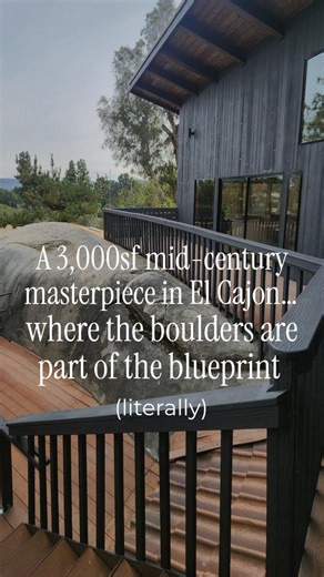 Amanda | San Diego Realtor | Local Expert on Instagram: "This mid-century masterpiece in El Cajon feels like it was built with reverence. Set among towering pines and massive granite boulders, it doesn’t try to tame the land—it falls in love with it, just like mid century modern homes are supposed to. 🌲🪨🌲 The boulders aren’t “landscaping”… they’re part of the soul. They even built the home around one, and downstairs in the office, a portion is left exposed like a heartbeat of the mountain, ri