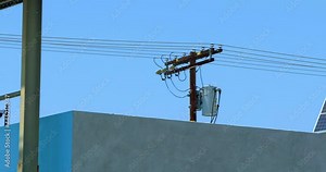 Solar panels installed on the roof of building as a part of alternative and conservation technology in Los Angeles, California, 4K