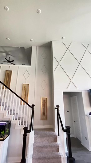 Living room and stairway makeover. #wainscoting #accentwall #homeimprovement #hgtv #homeinspo #emptyspace #ideas #stairway #livingroomdecor #highceilings