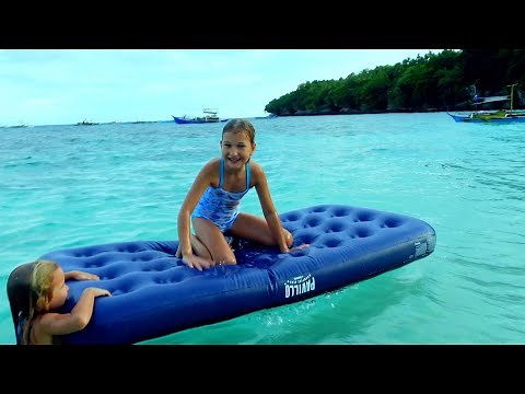 Children swim in the sea. 4k