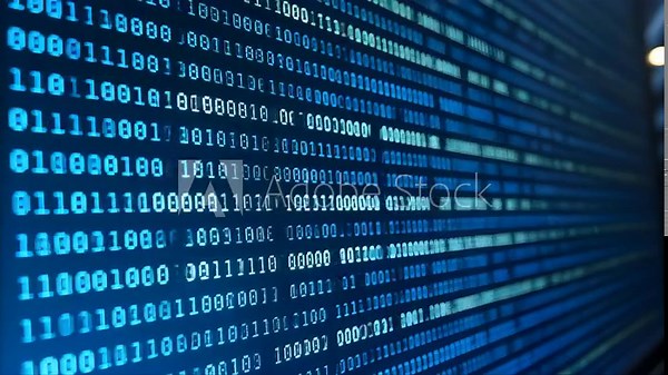 Blue binary code flows down a computer screen, representing a digital technology concept of data and communication