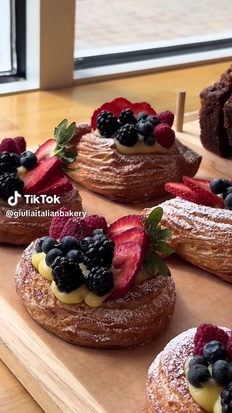 Delicious Bakery Treats: Croissants and Fresh Fruits