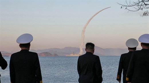 North Korean leader and daughter try out new tank