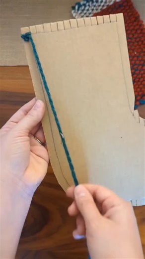 art&Crafts on Instagram: "Cardboard Loom Woven Stocking 🎁 Using cardboard to create a hand woven stocking! I cut notches around the top and bottom of a piece of cardboard cut into the shape of a stocking. Then, I wrapped yarn around the cardboard and behind the tabs. I cut a popsicle stick on one end, just enough to split the wood, to hold the yarn for weaving in place. We used the popsicle stick to help guide the yarn while weaving. Once you reach the bottom of the stocking you can pull the ya