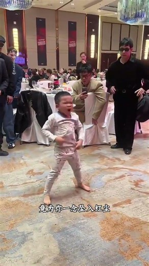 A 5-year-old kid was forcibly pulled to dance. At first I thought he was just a little bra