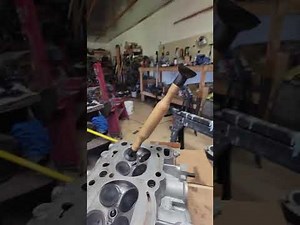 Valve grinding by hand.