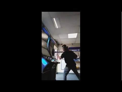 Angry Guy smashing slots machines after losing 1000 pounds