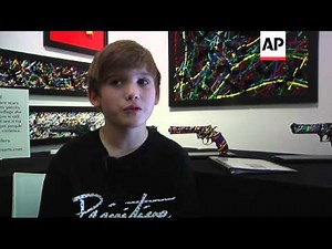 Eleven-year-old artist Charles Gitnick has created an exhibit that expresses his feelings about guns