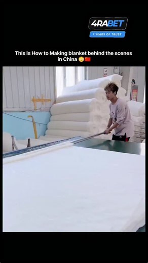 World_War on Instagram: "This video shows a process for layering and pressing cotton to create bedding material. Layers of cotton are manually arranged on a grid table to form a thick, uniform filling. A pressing mechanism then firmly compresses the cotton sheet. This process is commonly used in the production of bedding and quilting materials. The goal is to achieve a consistent thickness and density for the final product."